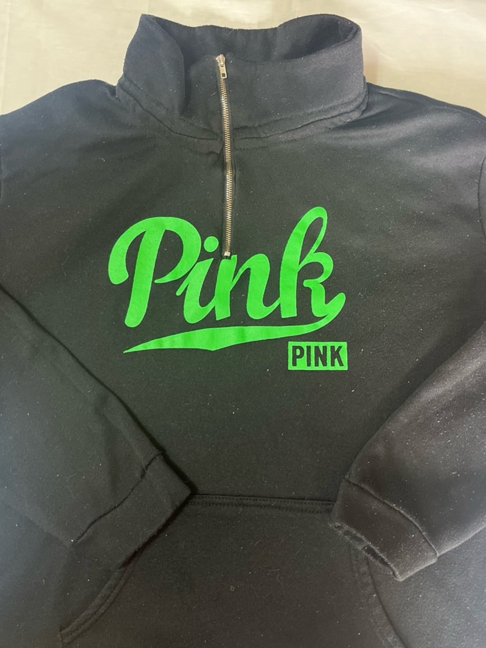 Black quarter zip sweatshirt with green logo fits size small/PM